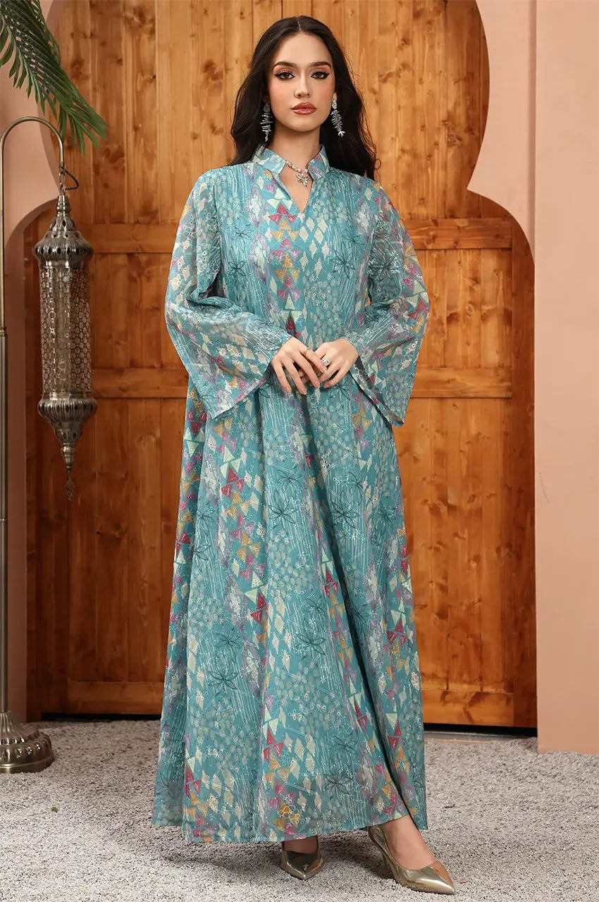 Tyrah light blue geometric print kaftan in a resort setting, perfect for luxury modest wear.