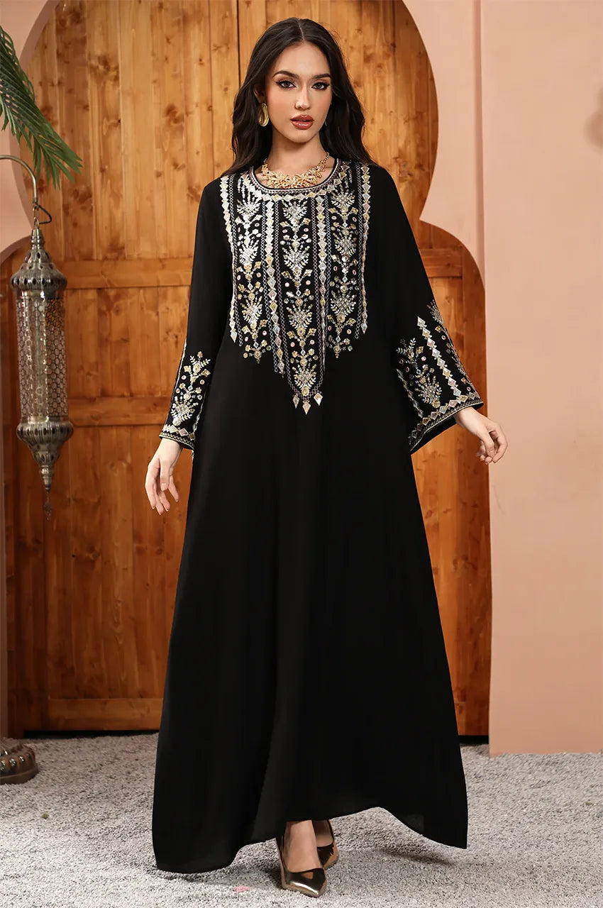 Floor-sweeping Zahia black Saudi kaftan with statement flared cuffs and a modest silhouette.