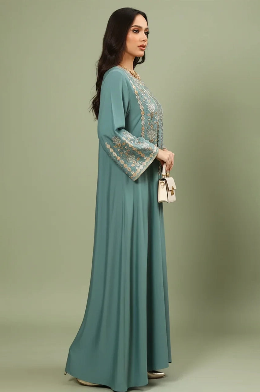 Side profile of the Zahia Green Saudi Kaftan highlighting the flared bell sleeves and tailored movement.