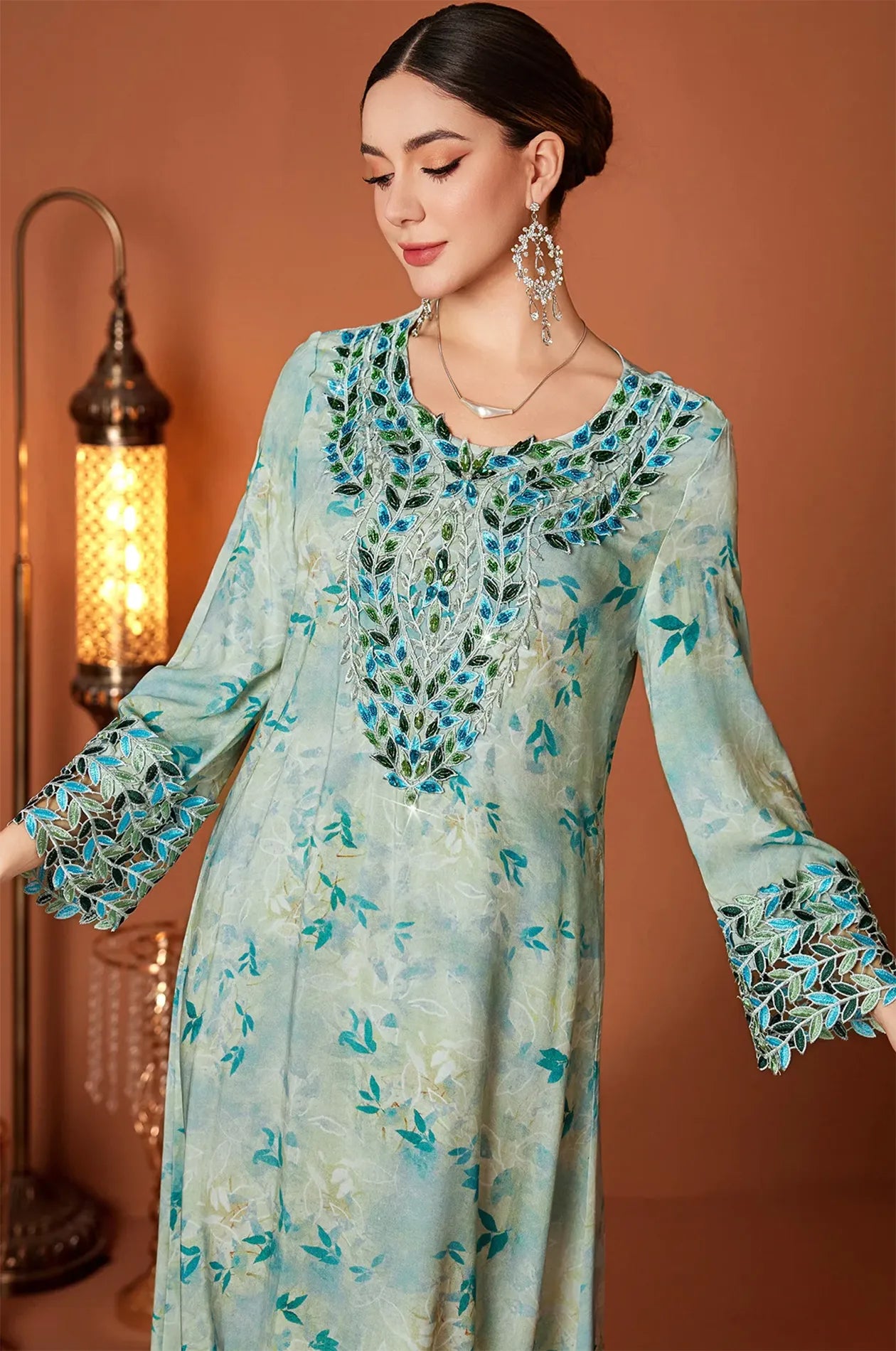 Model wearing the Zahri Mint Kaftan with luxury statement earrings.