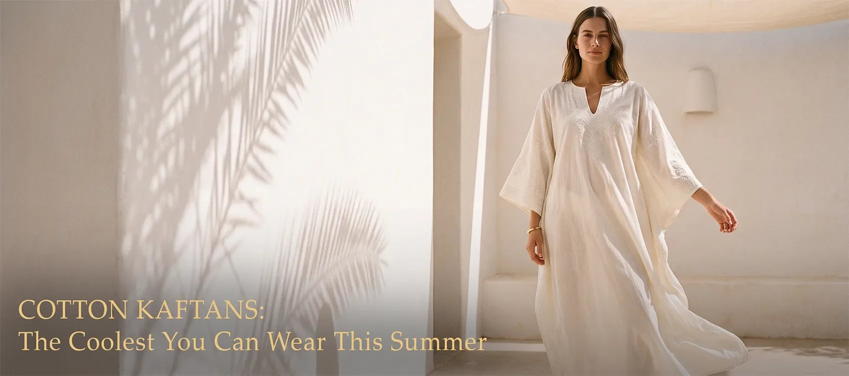 Ivory embroidered cotton kaftan in a sunlit whitewashed courtyard — Cotton Kaftans: The Coolest You Can Wear This Summer