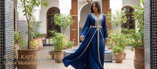 Wide shot of a model wearing a luxurious royal blue velvet Takchita walking through a tiled courtyard, illustrating the Moroccan Princess aesthetic.