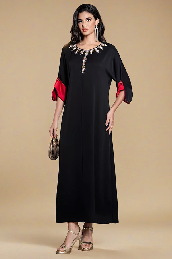 Model wearing Adara black satin kaftan dress front view