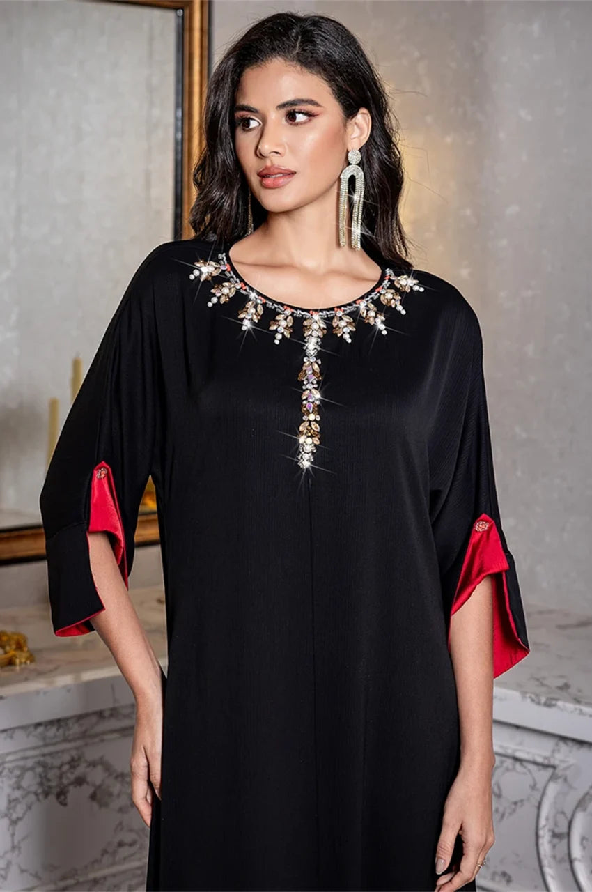 Close-up of crystal embellished neckline on Adara kaftan