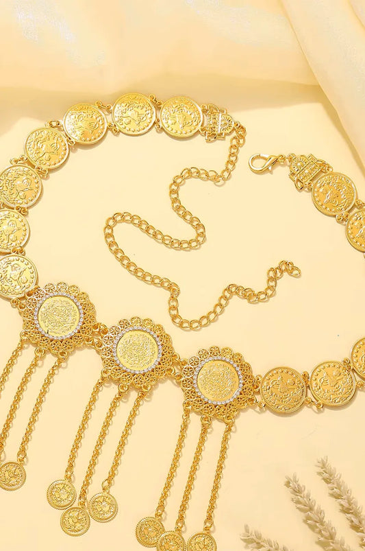 Detail of the lobster clasp and adjustable extender chain on the gold coin belt.