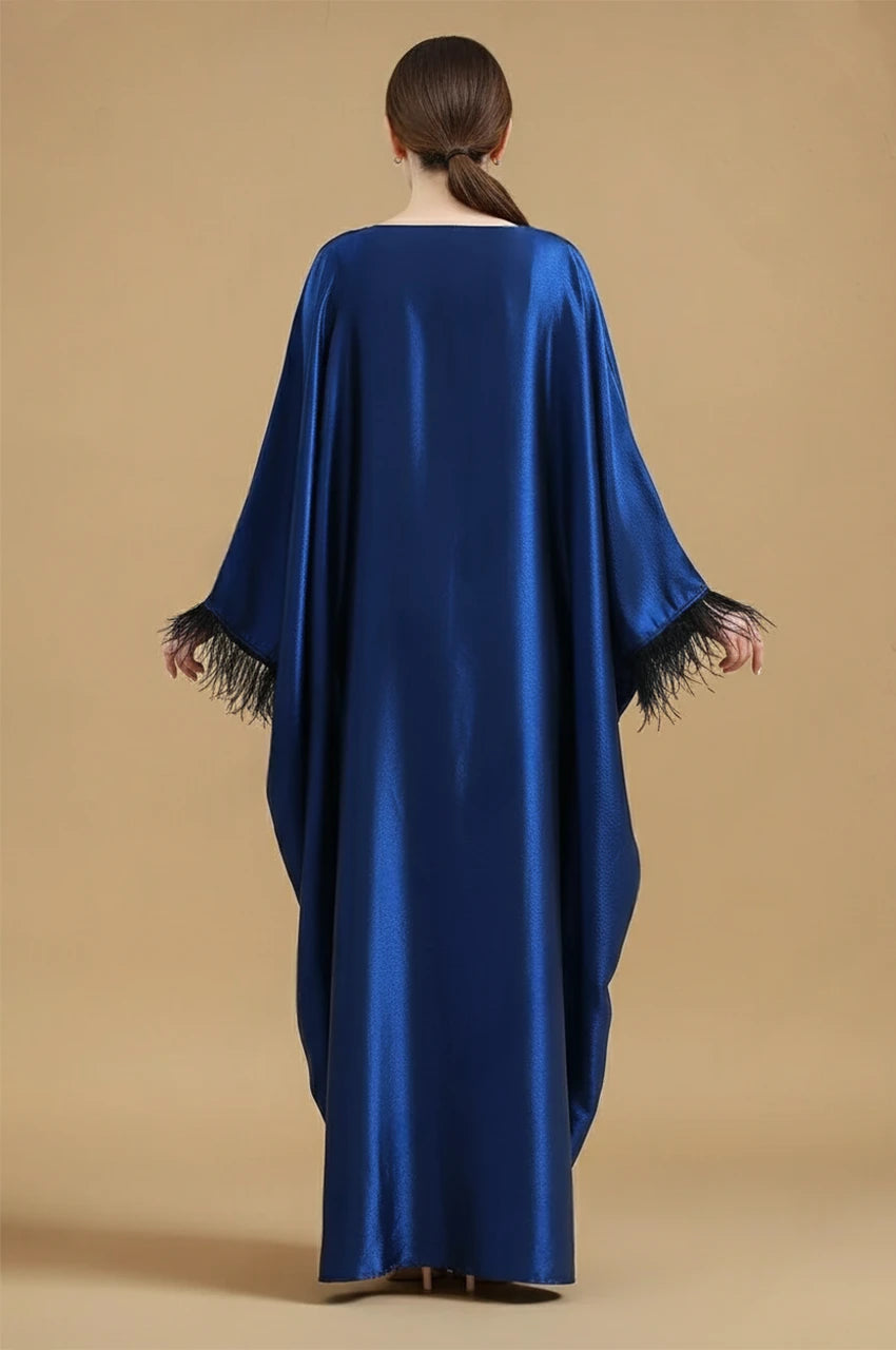 Back view of ALARA blue satin kaftan gown with long draped silhouette