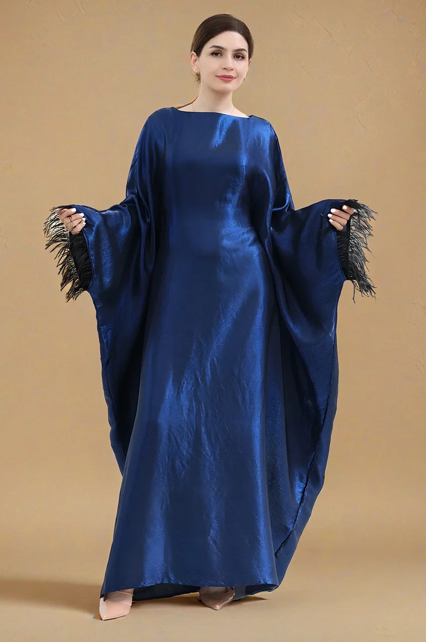 Elegant blue satin kaftan gown Alara with feather-trimmed sleeves