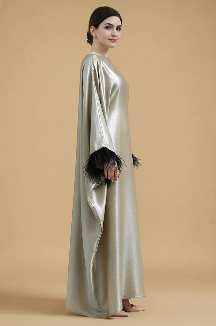 Side profile of ALARA green satin kaftan gown with draped silhouette