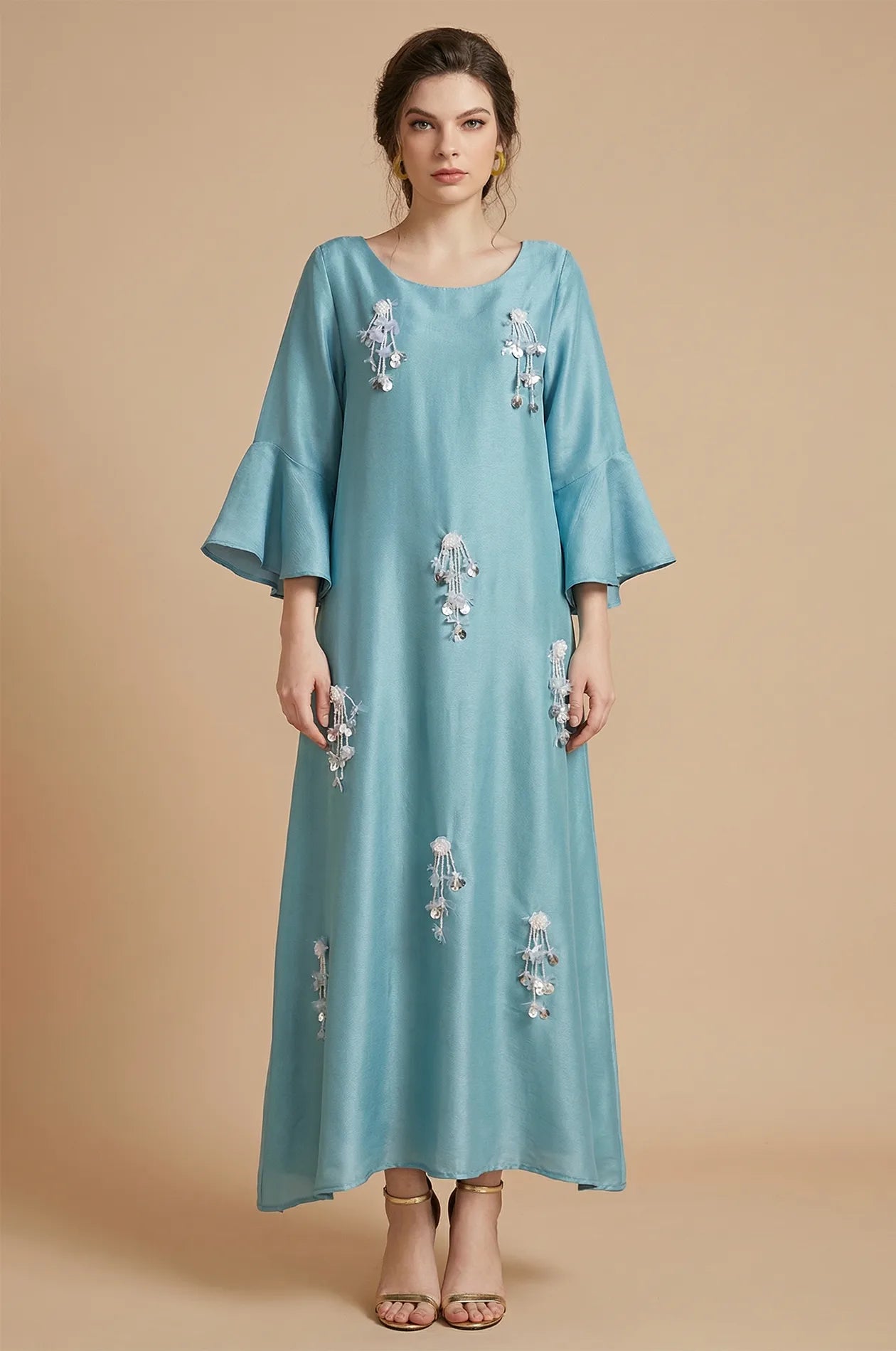 Front view of Alima aqua blue kaftan with floral beaded tassels.