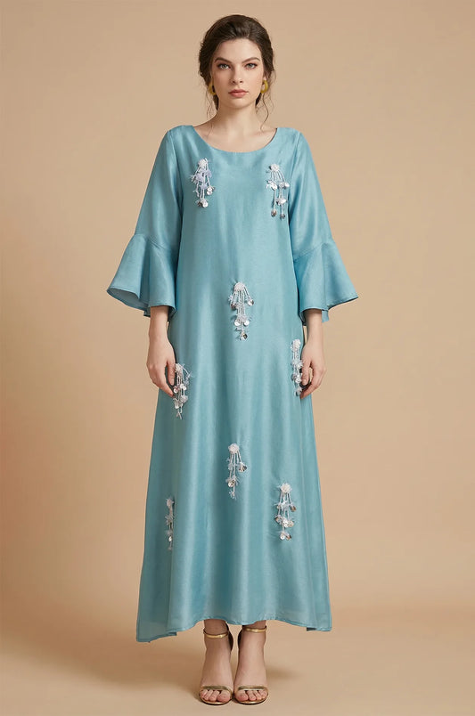 Front view of Alima aqua blue kaftan with floral beaded tassels.