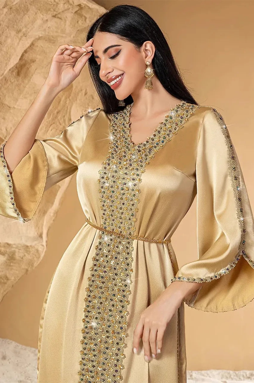 Close-up of embellished neckline on Almira champagne kaftan