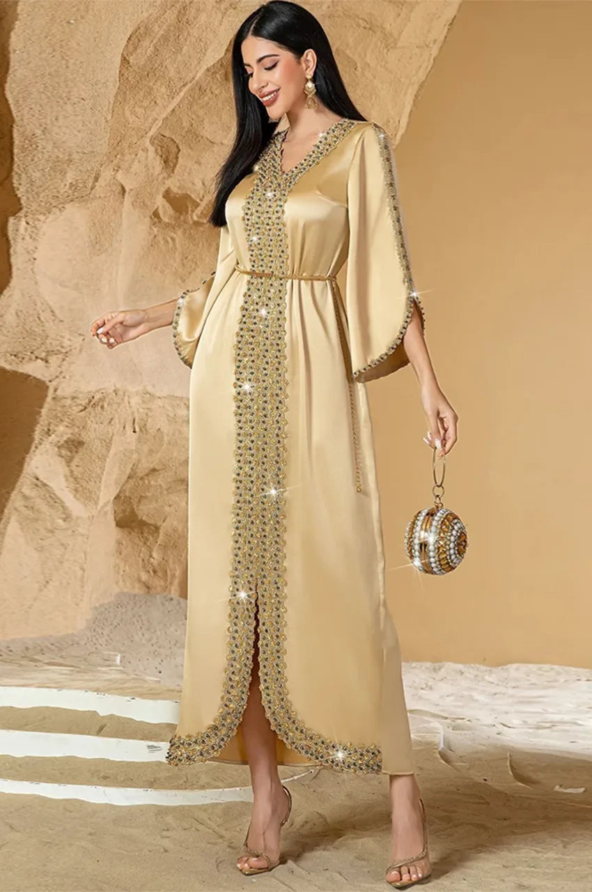 Full-length view of Almira champagne kaftan with beaded hem and front trim
