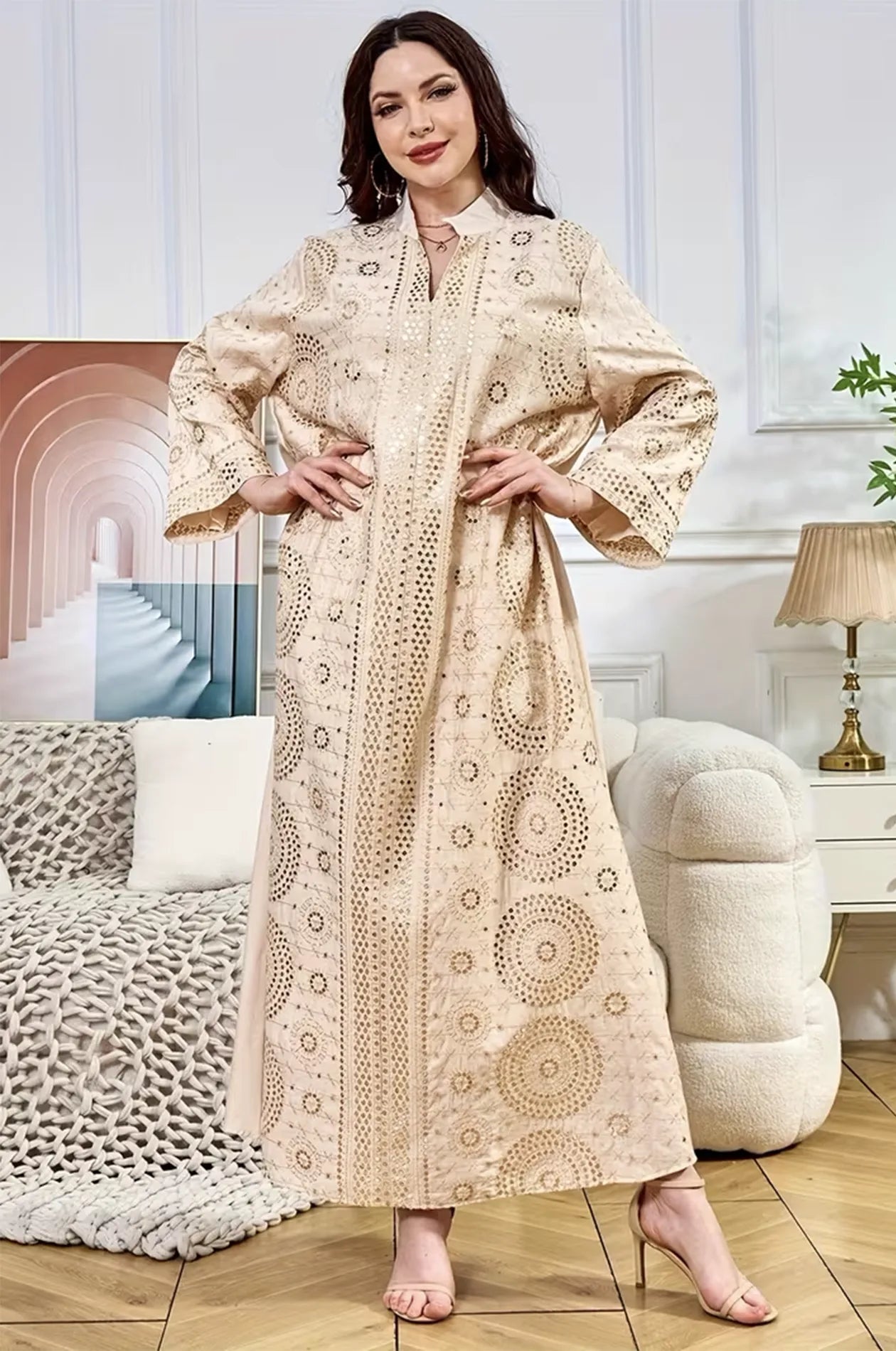 Stylish pose of the Aluna beige mirror kaftan by Naylara, demonstrating its fit as a luxury evening gown.