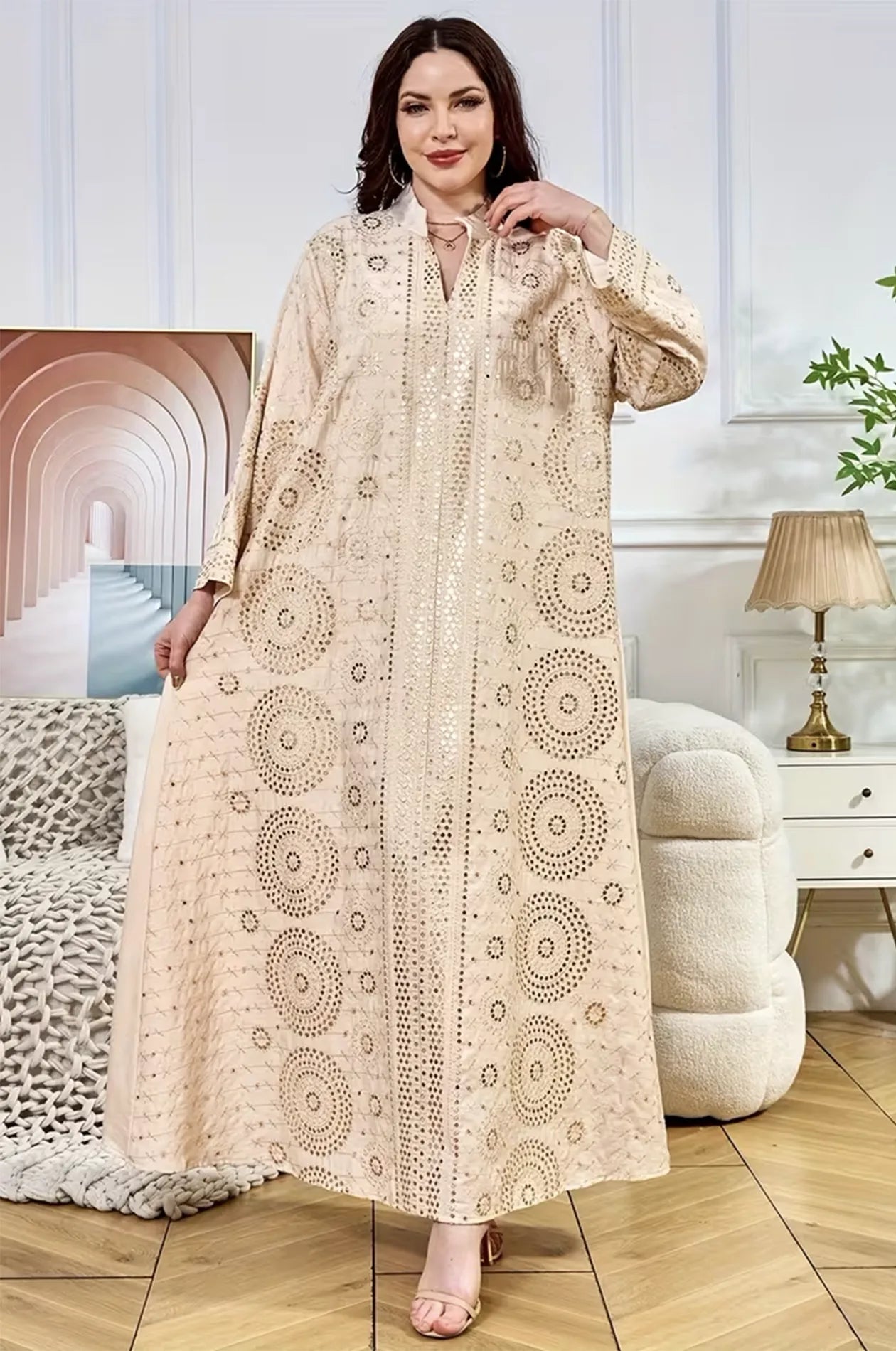 Model showcasing the Aluna beige mirror kaftan in a lifestyle setting, emphasizing the flowing lightweight fabric.
