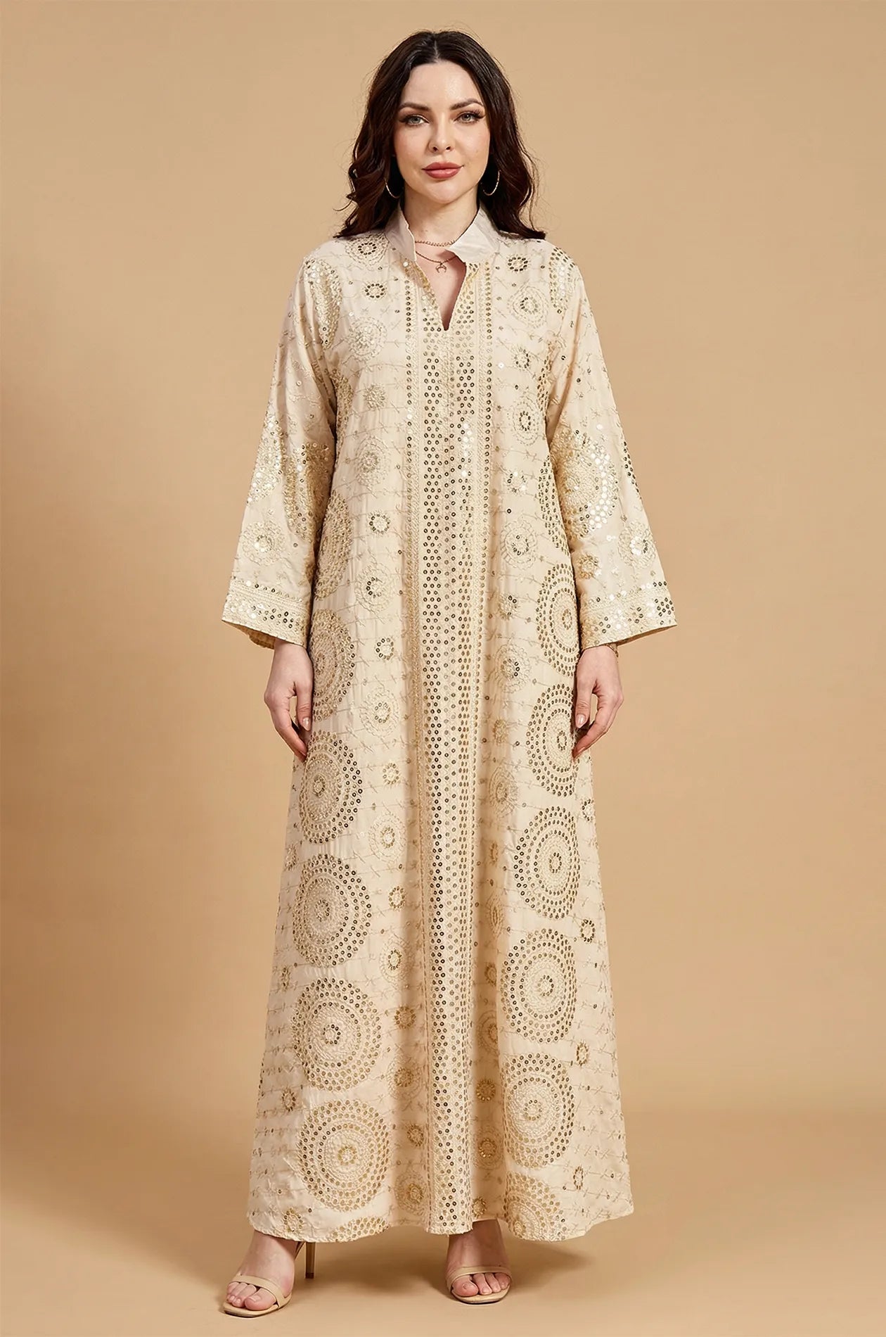 Full front view of the Aluna beige mirror kaftan by Naylara featuring intricate silver embroidery and a V-neckline.