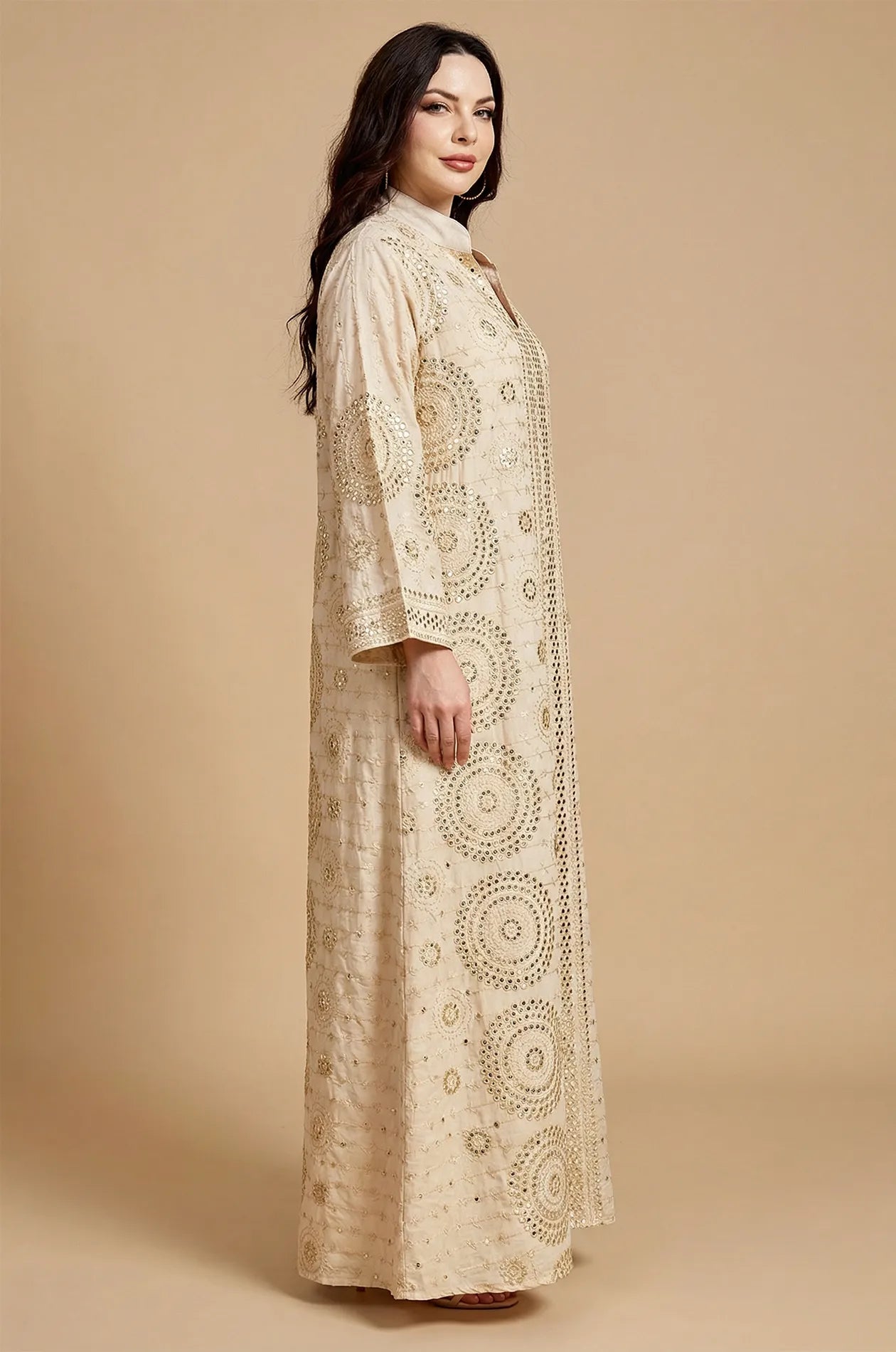 Profile view of the Aluna beige mirror kaftan highlighting the elegant drape and long embroidered sleeves.