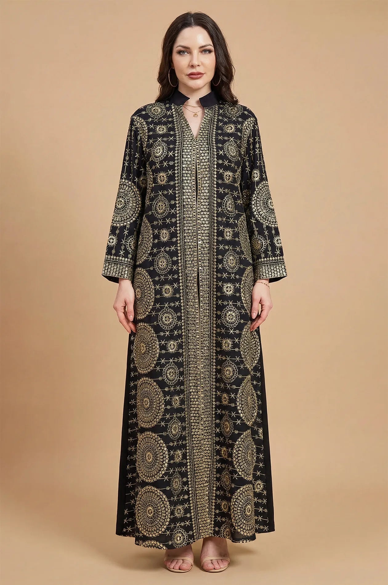 Formal studio front view of the Aluna black mirror kaftan with high-contrast gold geometric embroidery.