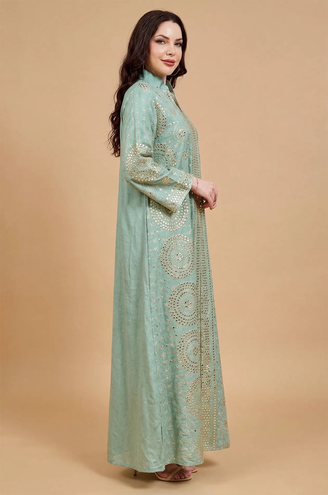 Side profile of the Aluna light green mirror kaftan highlighting the sleeve details and elegant flowing drape.