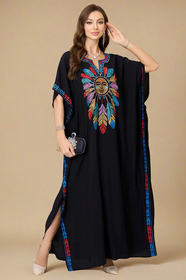 Front view of Amaya black embroidered cotton kaftan with colorful sun and feather motif