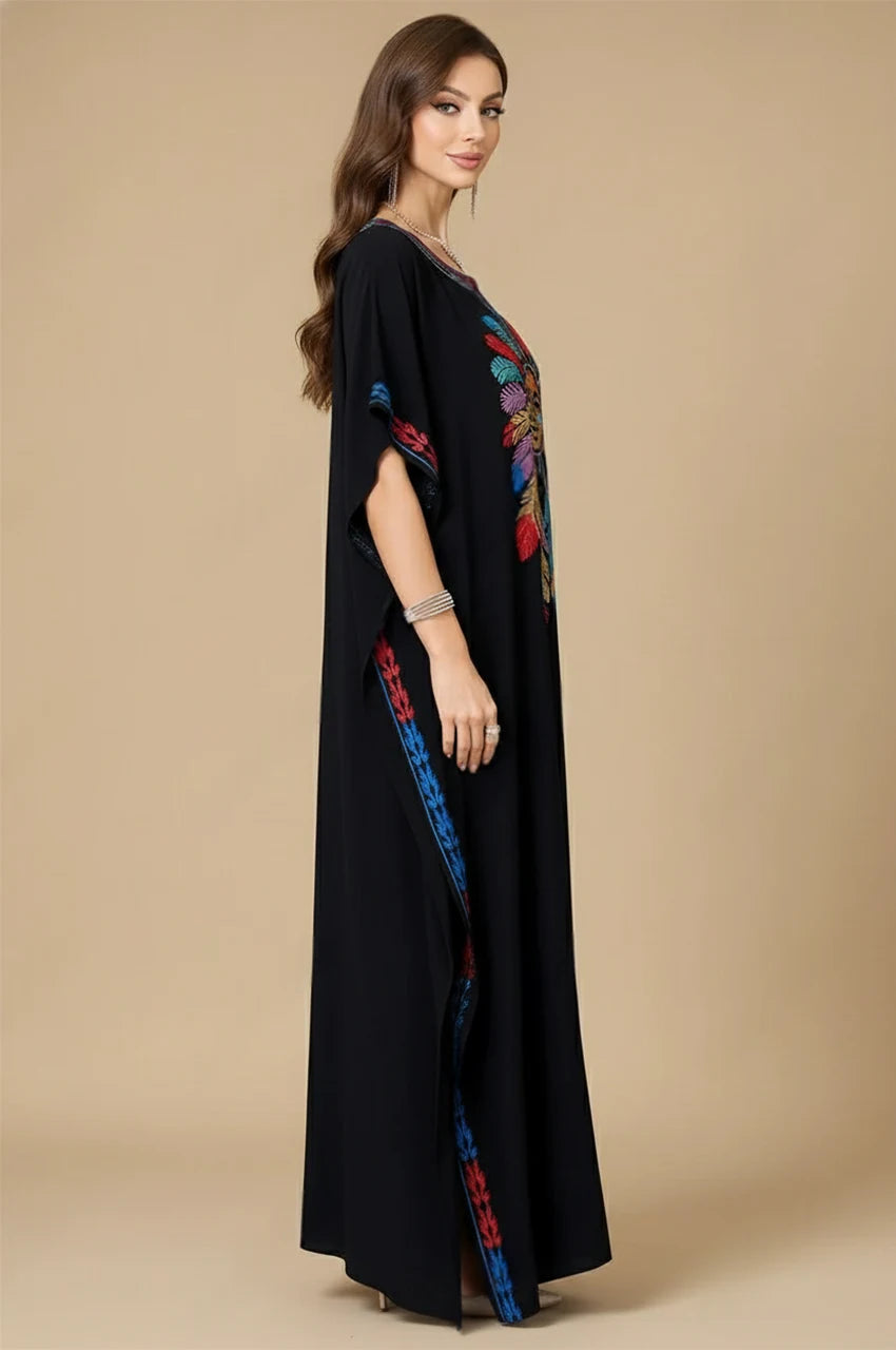 Side view of Amaya black embroidered cotton kaftan with colorful embroidered trim