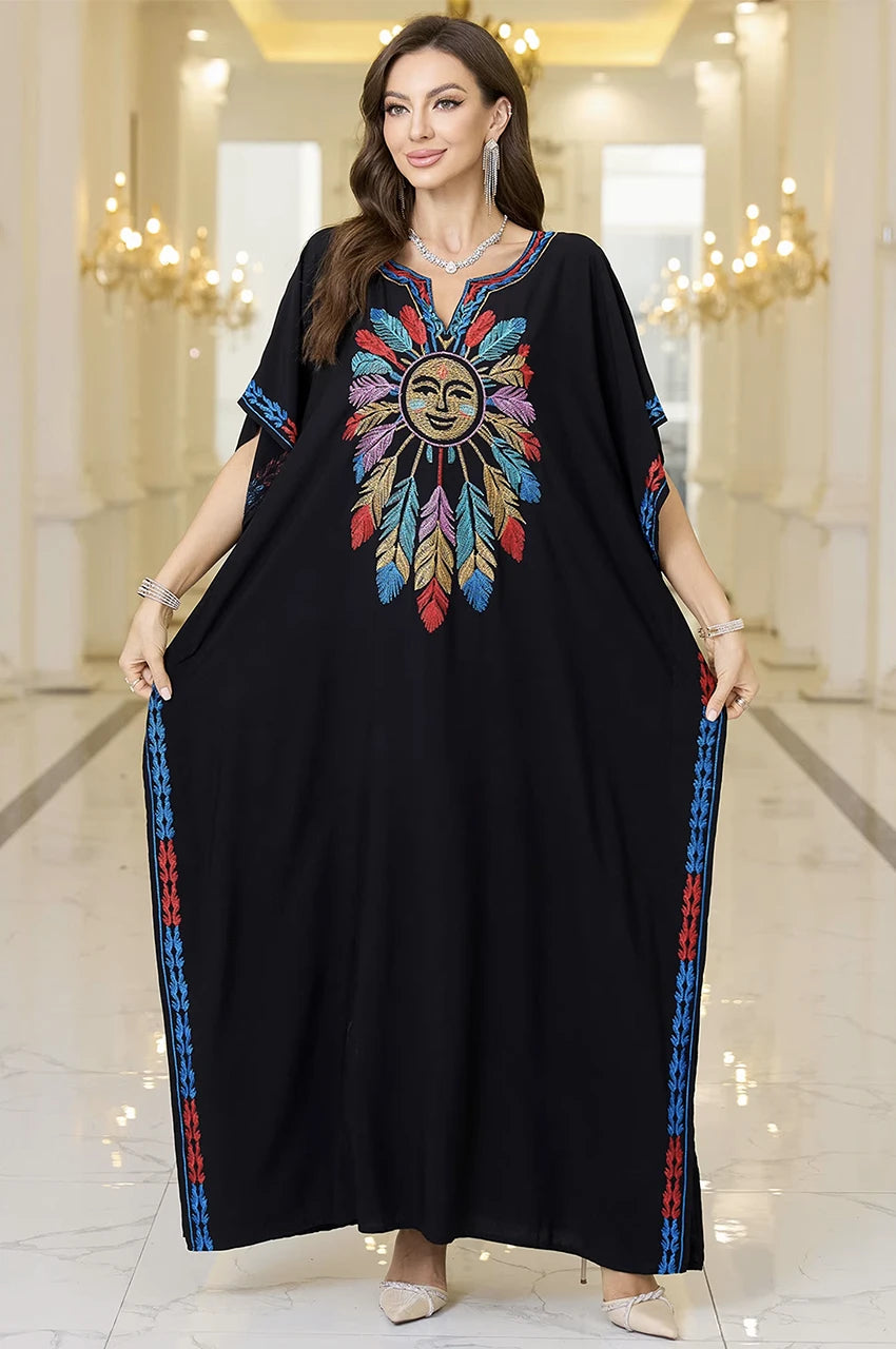 Amaya black cotton kaftan with colorful embroidery in luxury interior