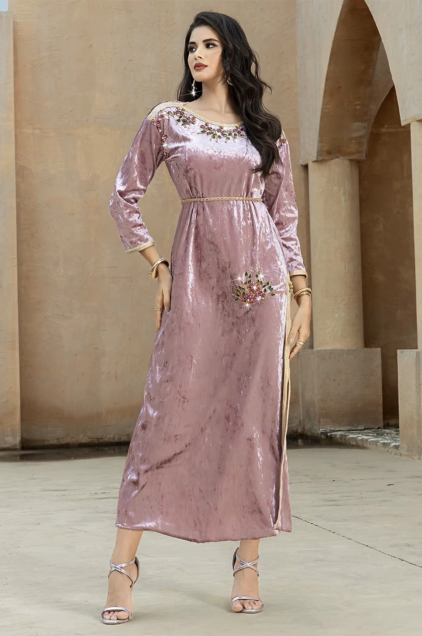 Neutral background full-length view of pink velvet Pakistani kaftan Amina