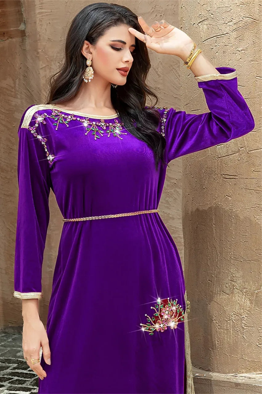Close-up of the upper body of the purple velvet Amina Pakistani kaftan with jeweled details