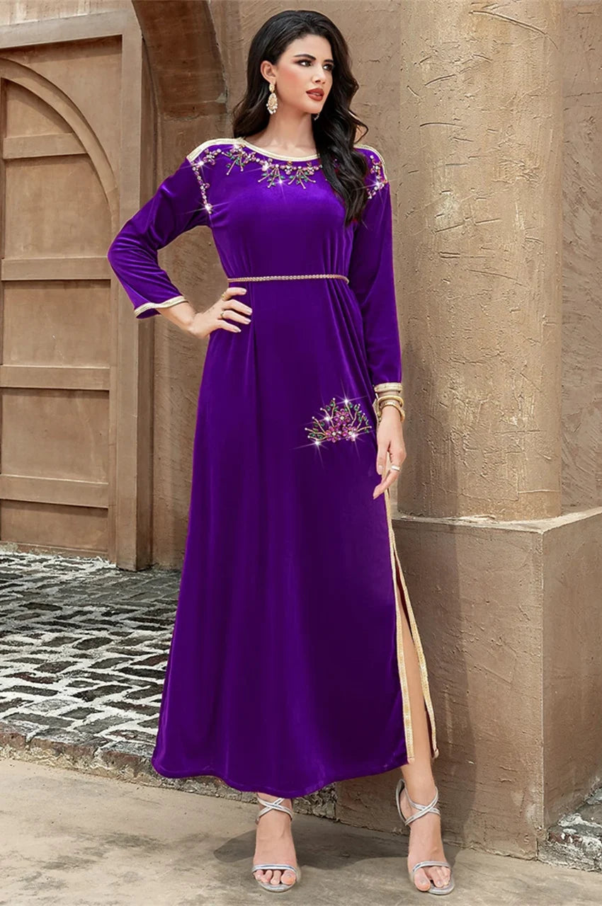 Full-body pose wearing the Amina purple velvet Pakistani kaftan with floral crystal embellishments