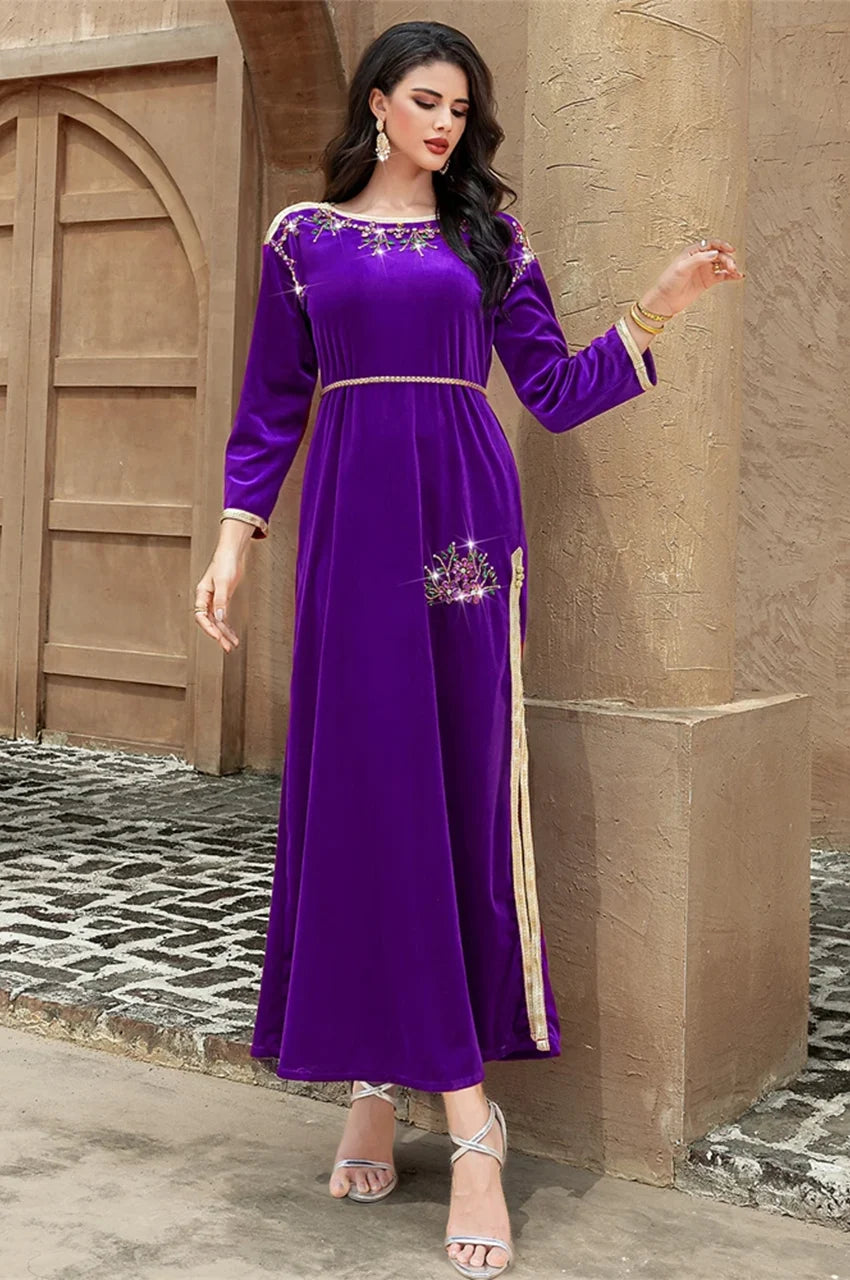 Detailed embroidery at the waist of the Amina purple velvet Pakistani kaftan
