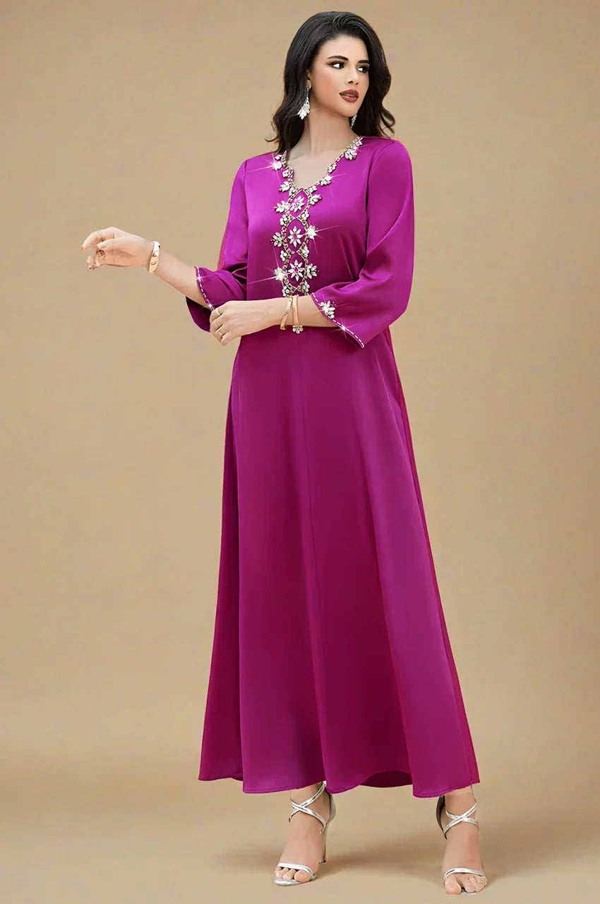 Front studio shot of Naylara Amira purple kaftan with long fluid silhouette