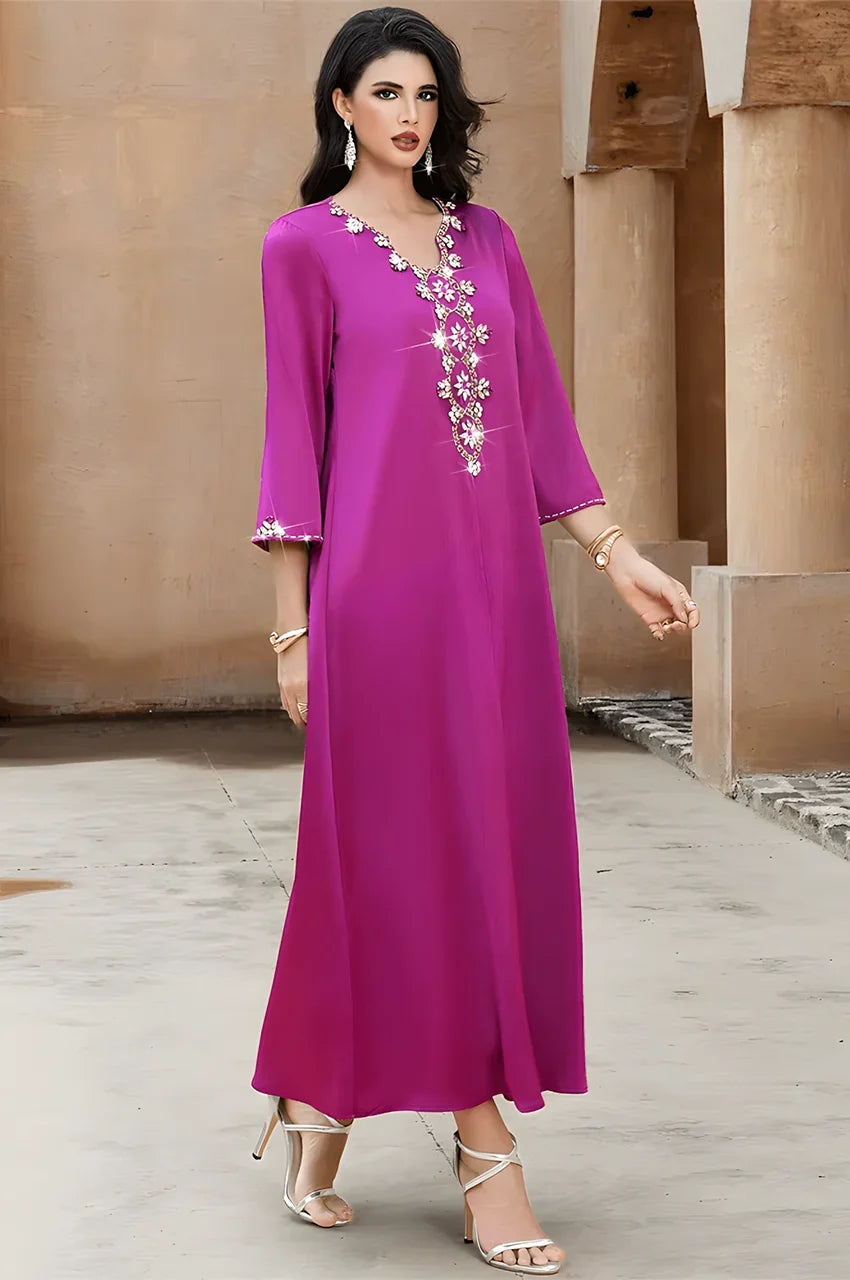 Model walking in Naylara Amira purple kaftan styled with heels