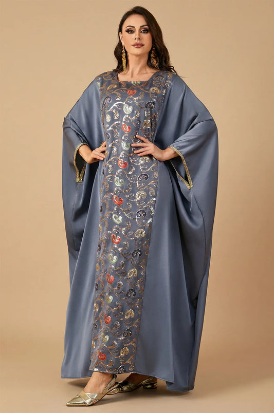 Full-length standing shot of the gray Amiri farasha kaftan on a neutral background for a clear product view.