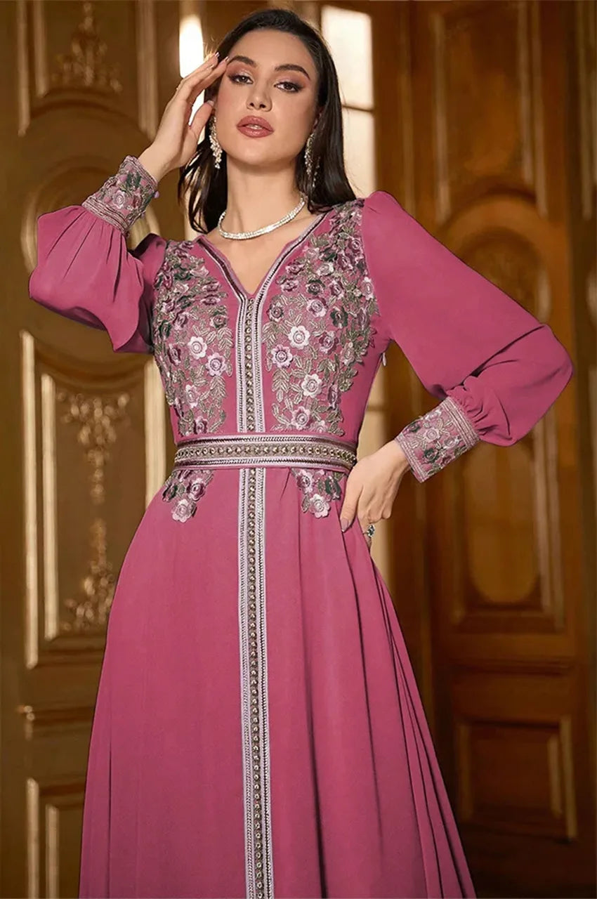 Close-up of floral embroidery on Arisa hot pink kaftan bodice