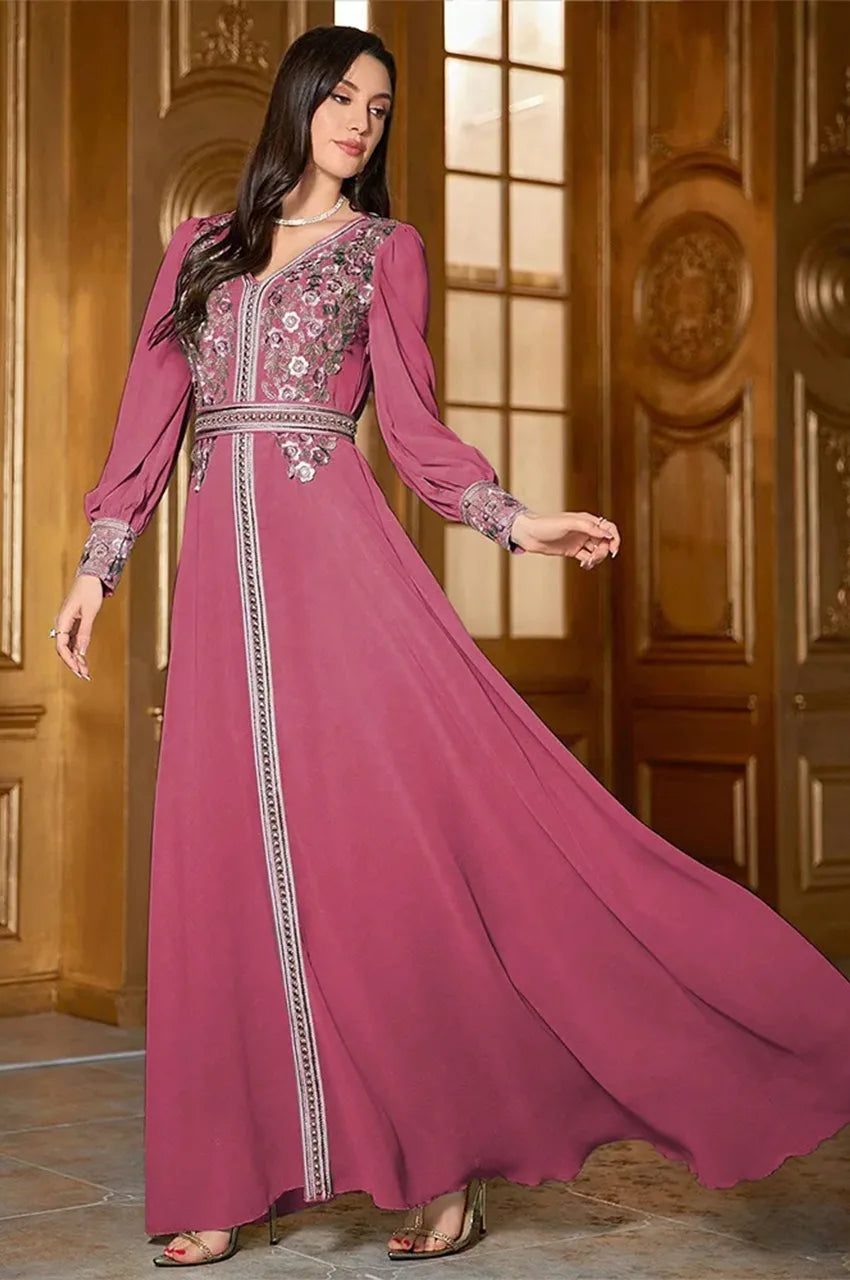 Arisa hot pink kaftan, side twirl showing flowy hem and delicate floral embroidery along V-neck and waist