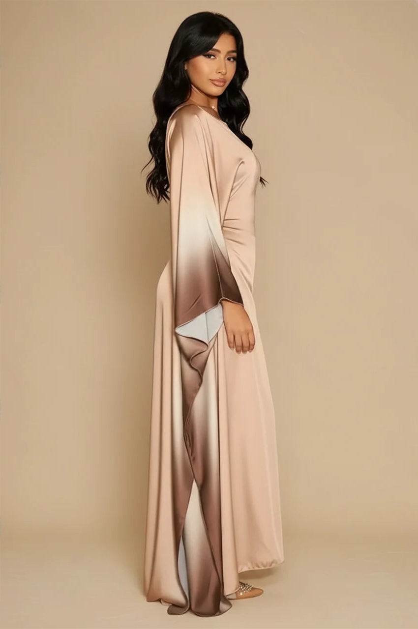 Side profile of model wearing Auressa Beige Butterfly Kaftan with gradient satin flow