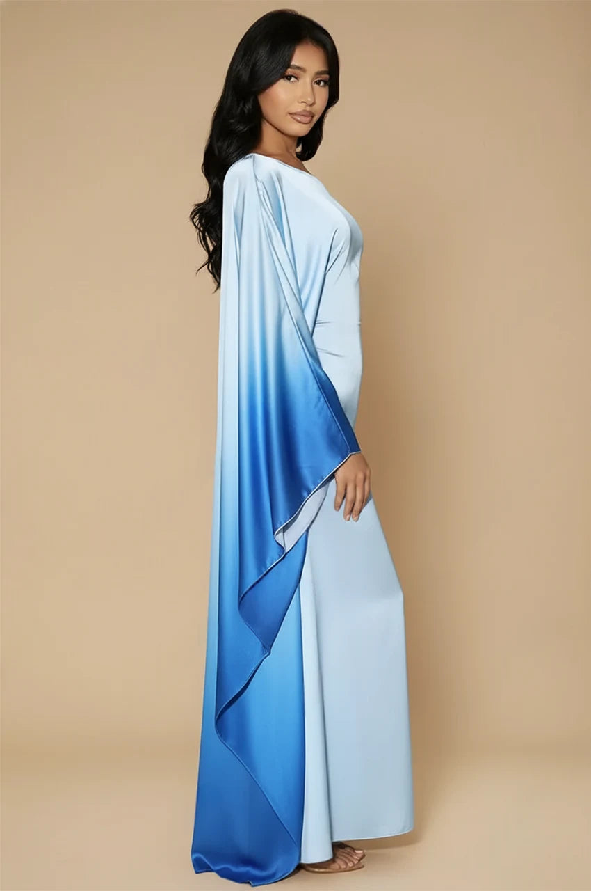 Side profile of model wearing Auressa Sky Blue Butterfly Kaftan with flowing gradient drapes
