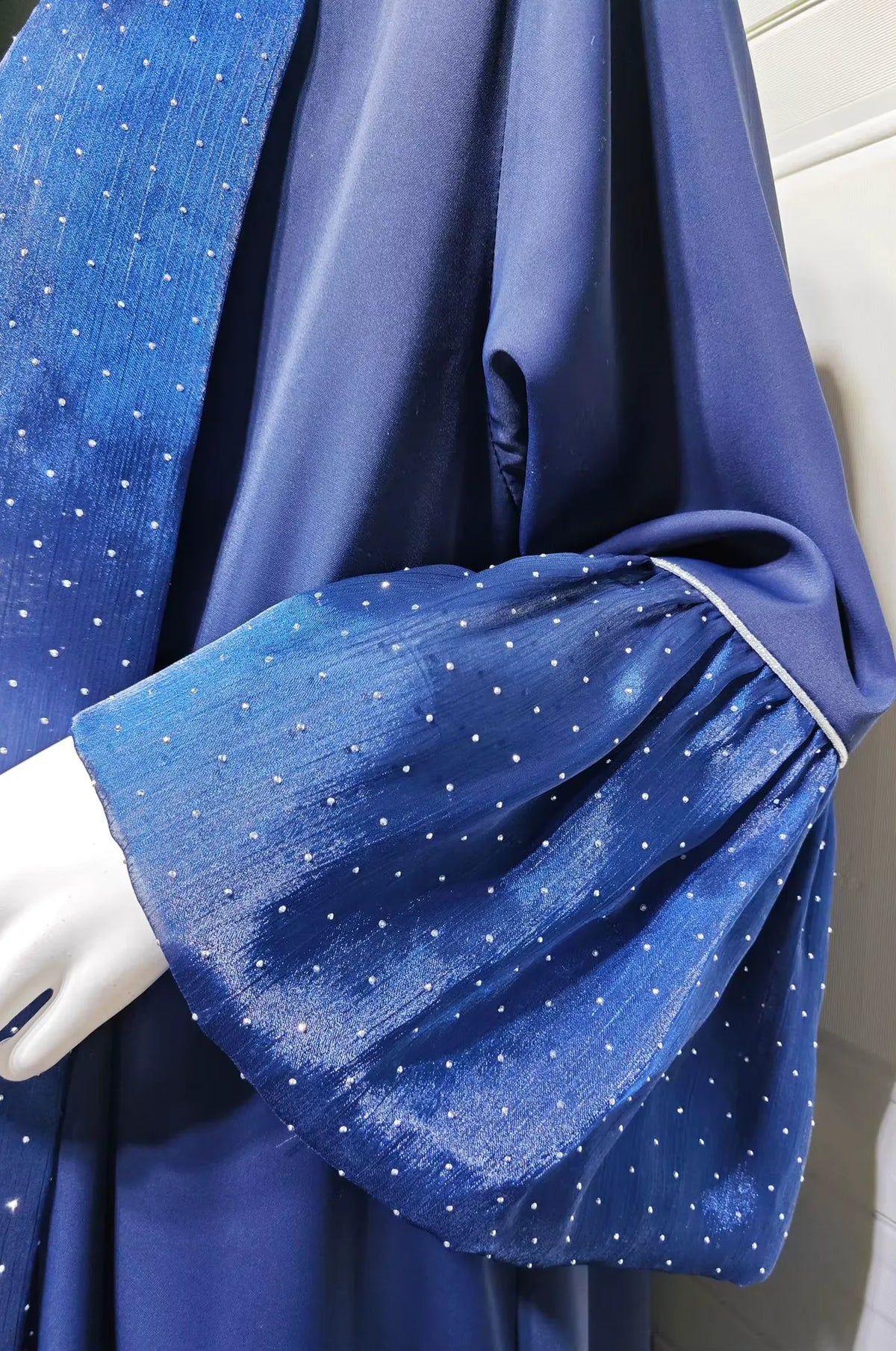 Close-up of the Auris Blue Kaftan's ruffled sleeve featuring delicate rhinestone dots and premium fabric texture.