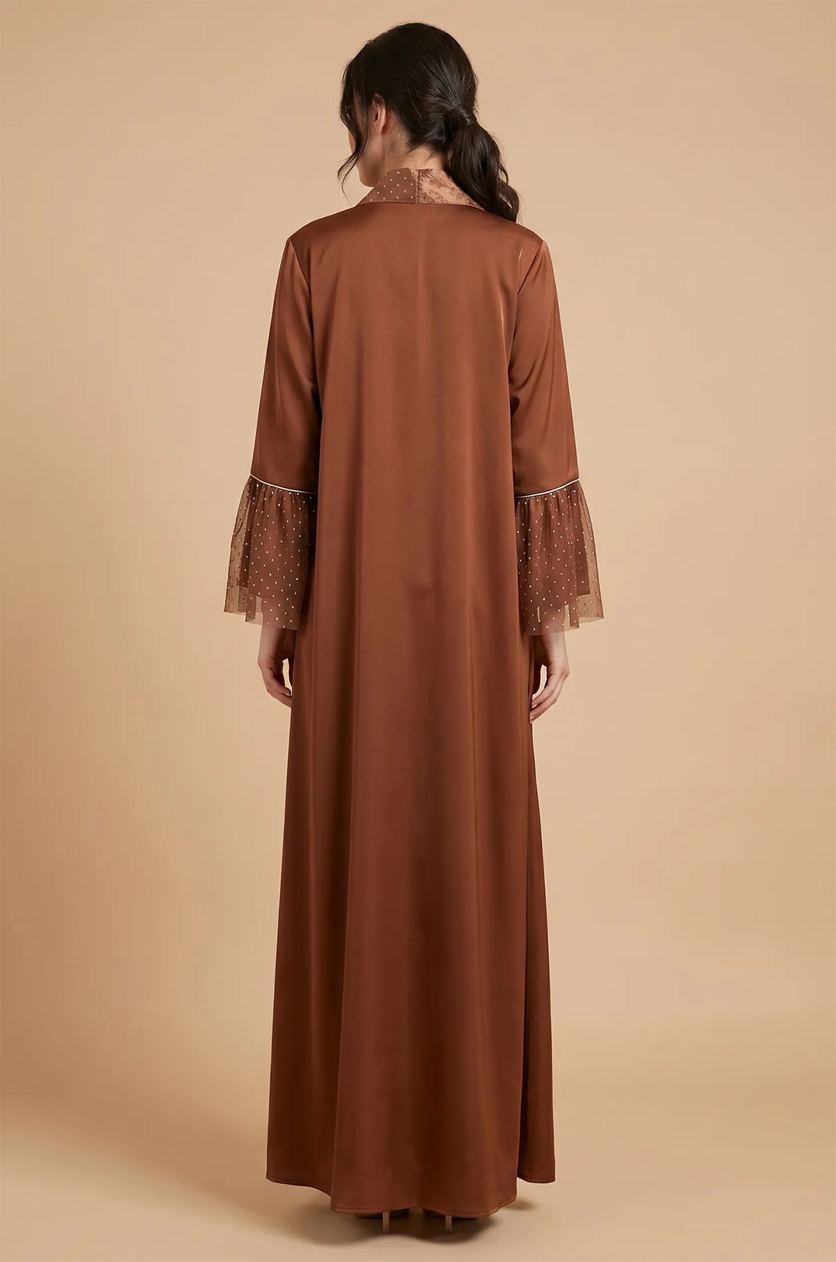 Rear view of the Auris Brown solid color Kaftan showing the elegant floor-length drape and the shimmering textured collar.