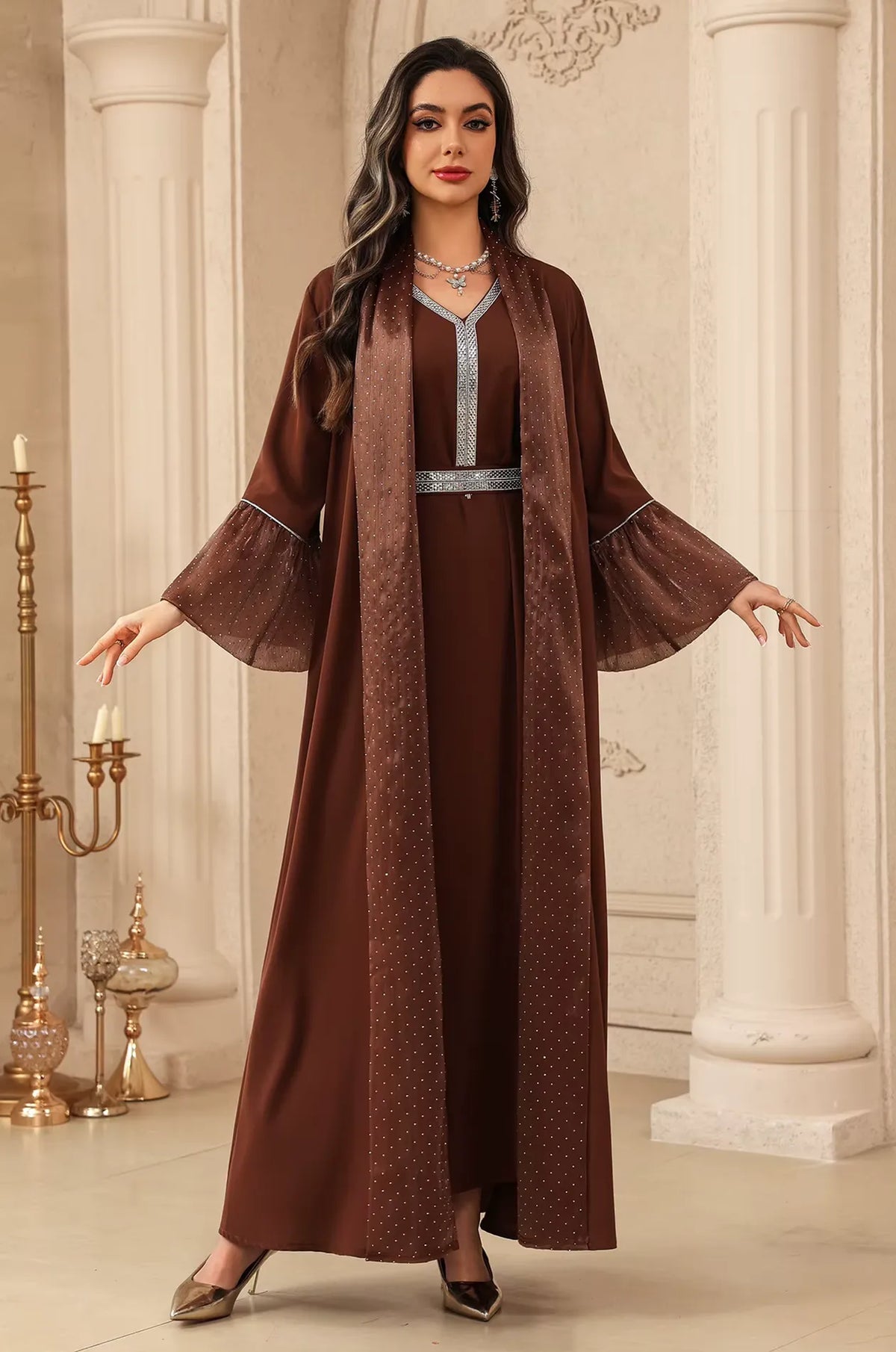 The Auris Brown Kaftan showcased in a luxury interior, demonstrating its suitability as a formal evening or wedding gown.