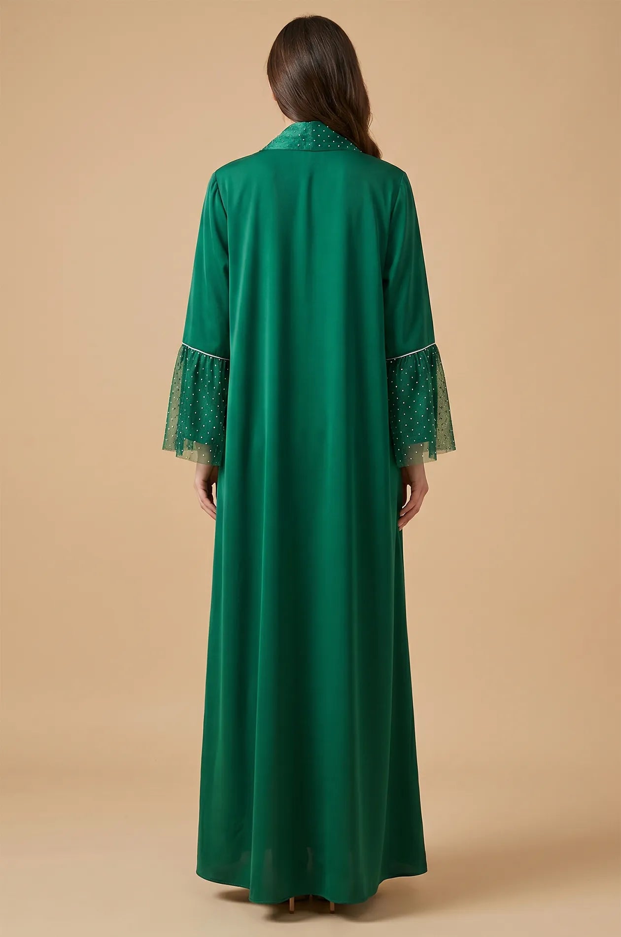 Rear view of the Auris Green solid color Kaftan showcasing the floor-length drape and the back of the shimmering collar.