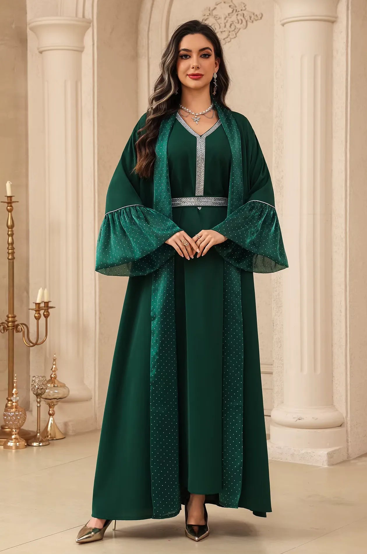 Standing front view of the Auris Green Kaftan by Naylara, featuring crystalline accents and a cinched waist for a sophisticated look.