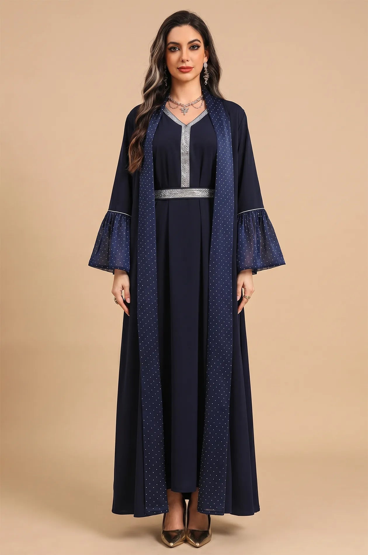 Professional studio portrait of the Auris Blue solid color Kaftan showcasing the full-length modest design and silver trim.