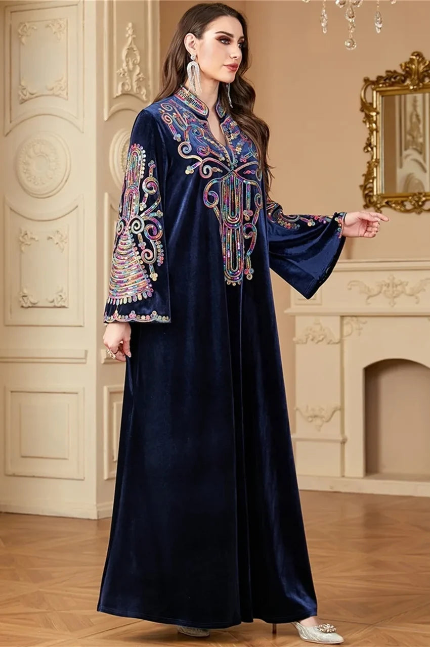 Angled view of Avela velvet kaftan highlighting intricate sequin patterns.