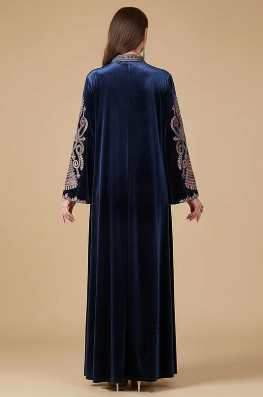 Back view of the Avela velvet kaftan showing full length and sleeve detailing.