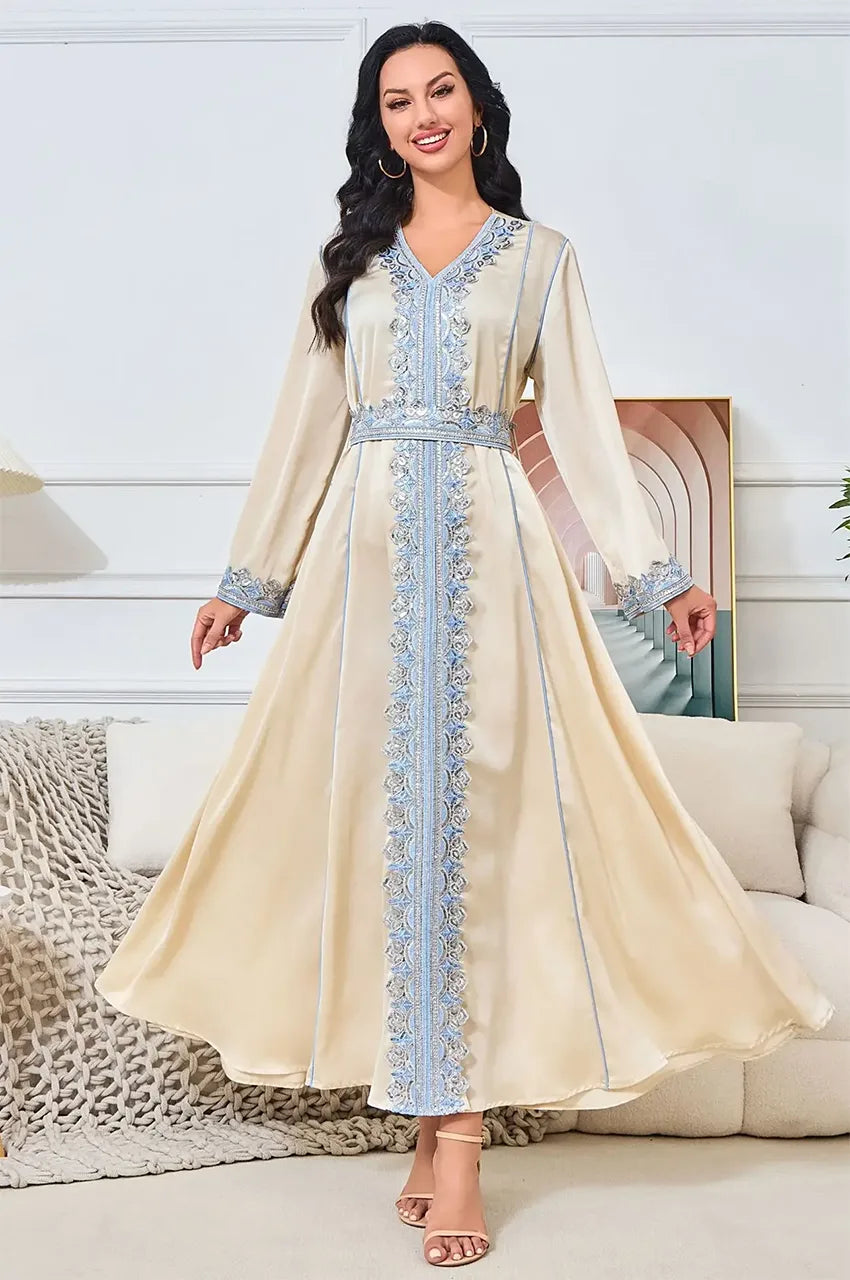 Motion shot of the Ayana long satin kaftan showing fabric drape and flow.