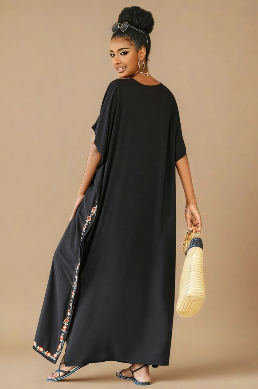 Aylen black bohemian embroidered kaftan lifestyle back view with side floral trim