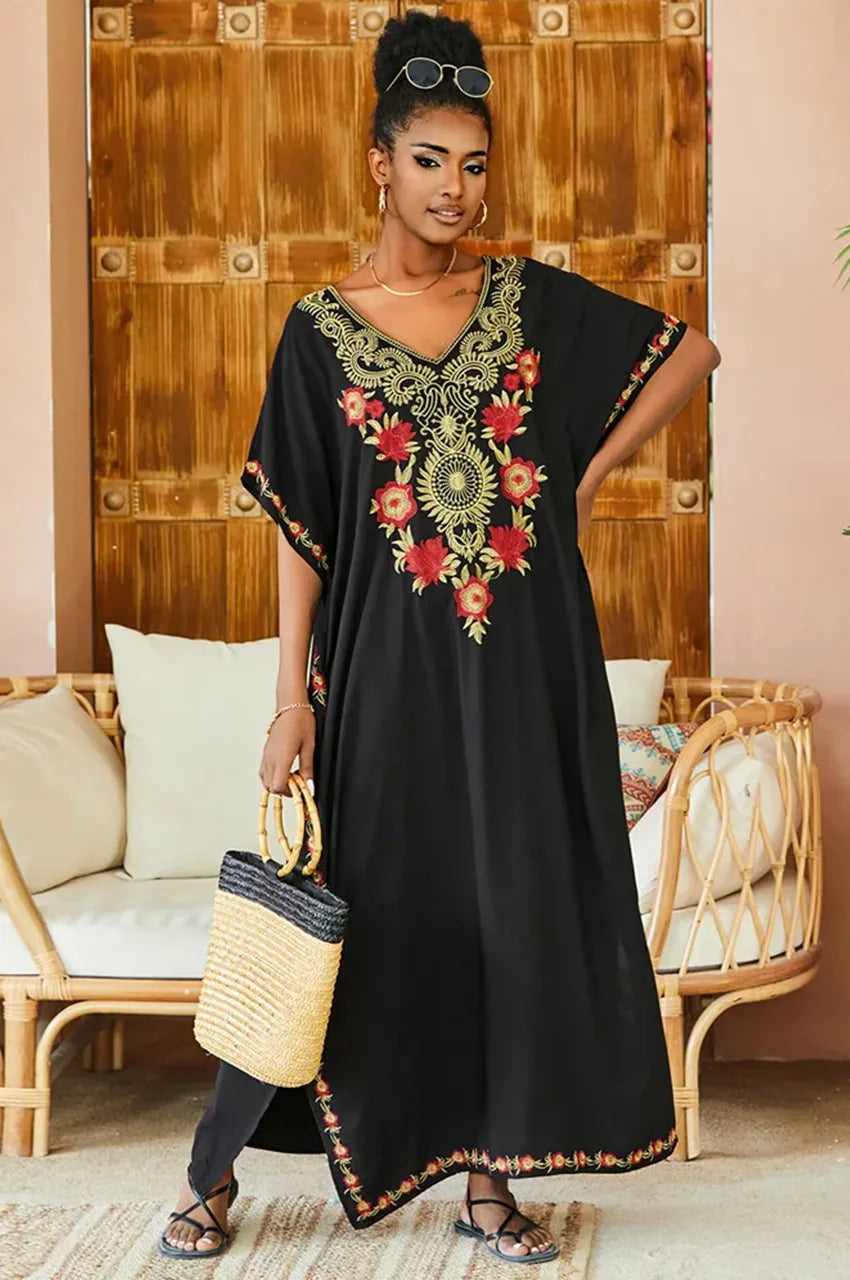 Model wearing Aylen black bohemian embroidered kaftan standing full-length