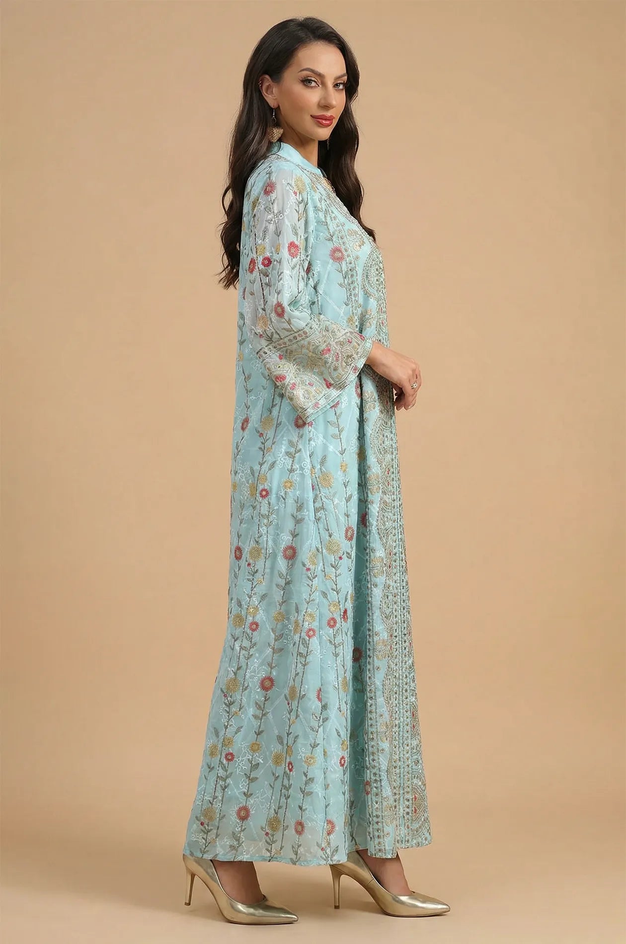 Side profile of a model wearing the Azari mint green chiffon kaftan maxi dress showcasing the flowing fabric and modest cut.
