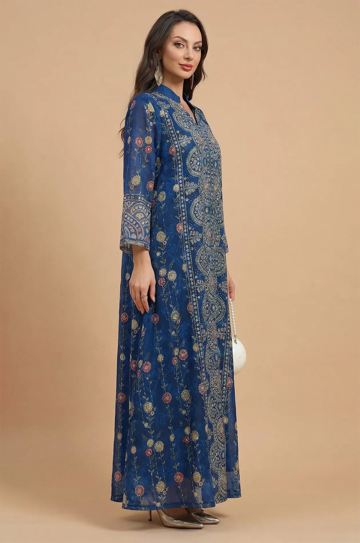 Side profile of the navy Azari chiffon kaftan dress showcasing the flowing drape and wide bell sleeves.