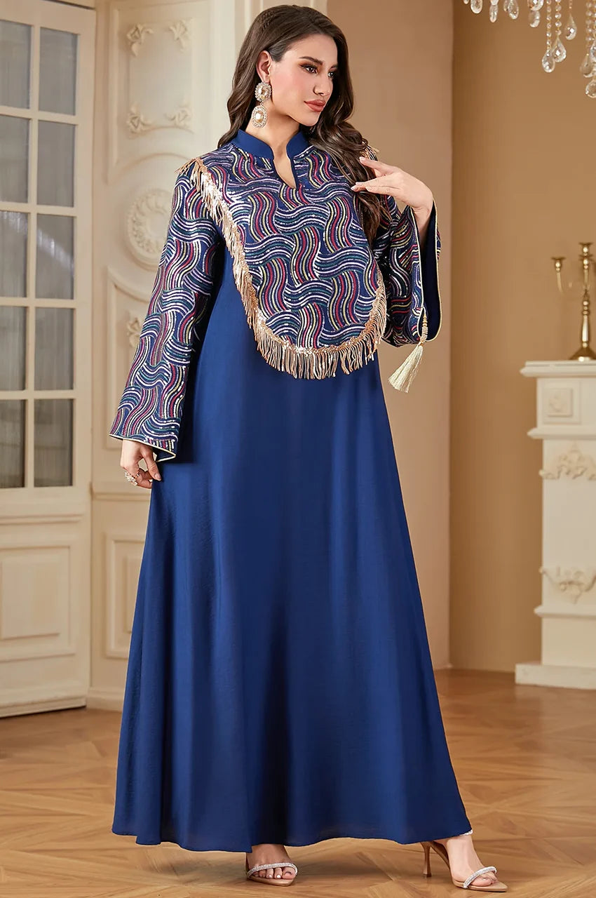 Angled shot showing bell sleeves on the Aziah blue kaftan.